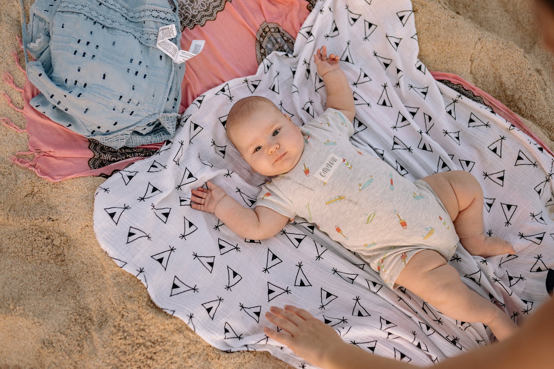 baby lying on beach